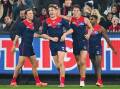 Bayley Fritsch (2nd left) kicked a goal of the year contender as the Demons toppled the Cats. (Morgan Hancock/AAP PHOTOS)