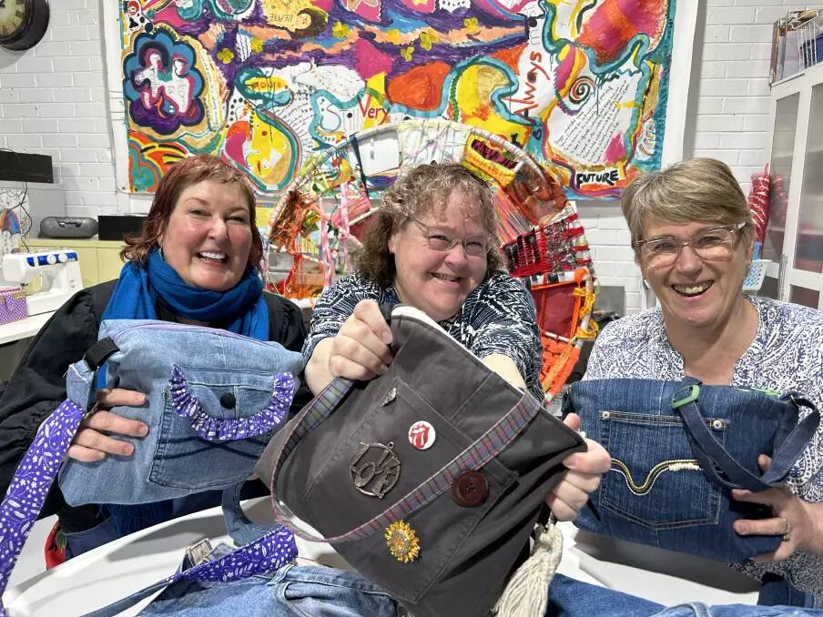 Creative Space Southern Highlands team leader Tania McInnes, Sewing: Your Style course graduate Sarah Prince and Moss Vale TAFE teacher Nola Peters with the bags they created in 2023. The course aims to give people confidence sewing and expand their skills for employment. Picture supplied
