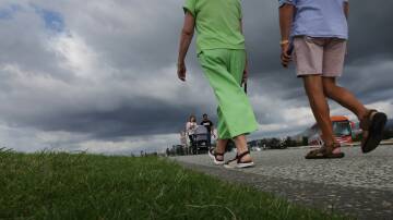 People walk under cloudy skies at Flagstaff Hill. File picture by Sylvia Liber