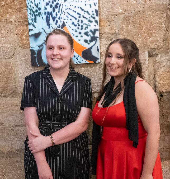 The college's Dux Audrey Laing stands with classmate Harriet Blaik, who plans to study primary school teaching. They are pictured at the college's celebratory dinner, which took place in November. Picture supplied. 