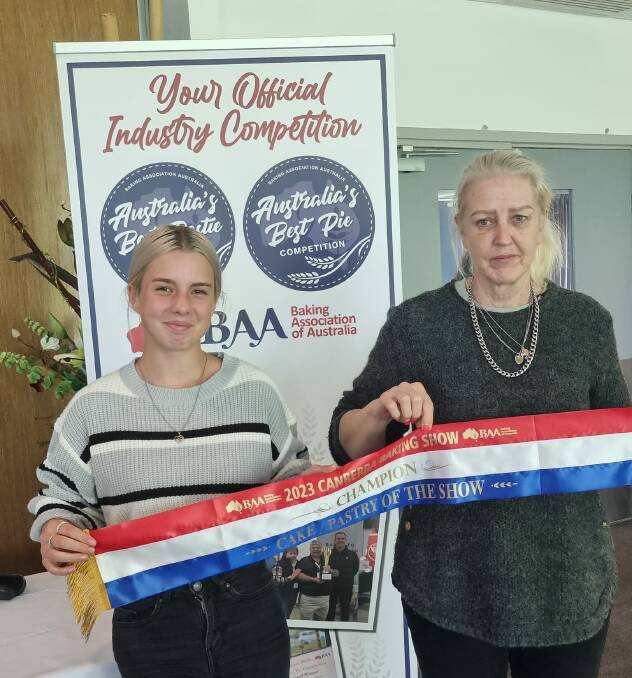 Annabelle Duff and Nerida Rudolph from Samuel Gees Pies and Pastries hold the ribbon for champion bake at the Canberra Show, which the business won for its roasted lamb and vegetable pie. Picture supplied. 