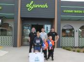 El Jannah Tahmoor employees Lyder Kingbeer, Luke Loprete and Alessandro Loprete with Edward, Hugh and Douglas Hallowell when they went to collect cans to raise funds for sick kids. Picture supplied 