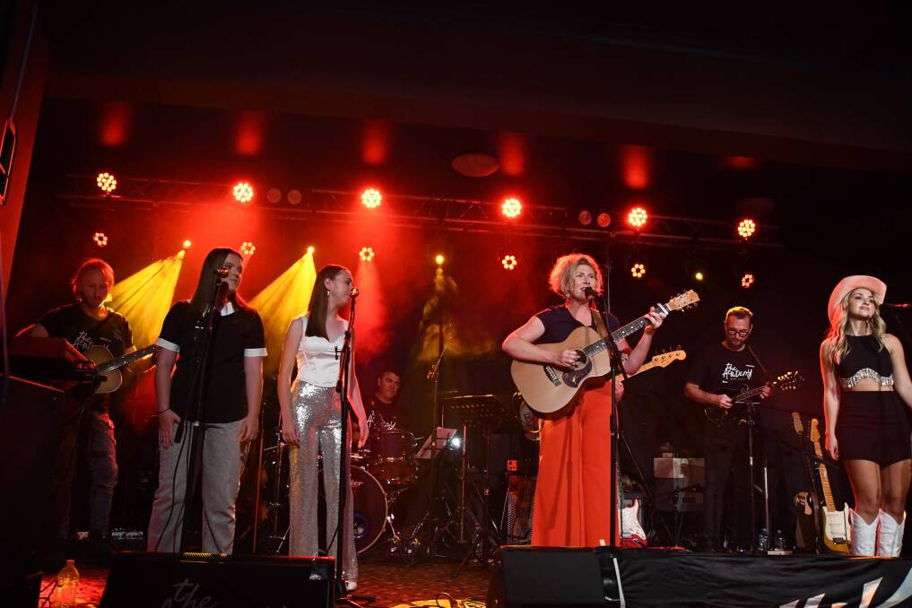 The Academy course in Tamworth has helped Robertson singer-songwriter Amber Kenny (third from the right holding the guitar) create more goals for performing in the Highlands. Amber performed at the graduation concert with a band in January, 2023. Picture supplied. 