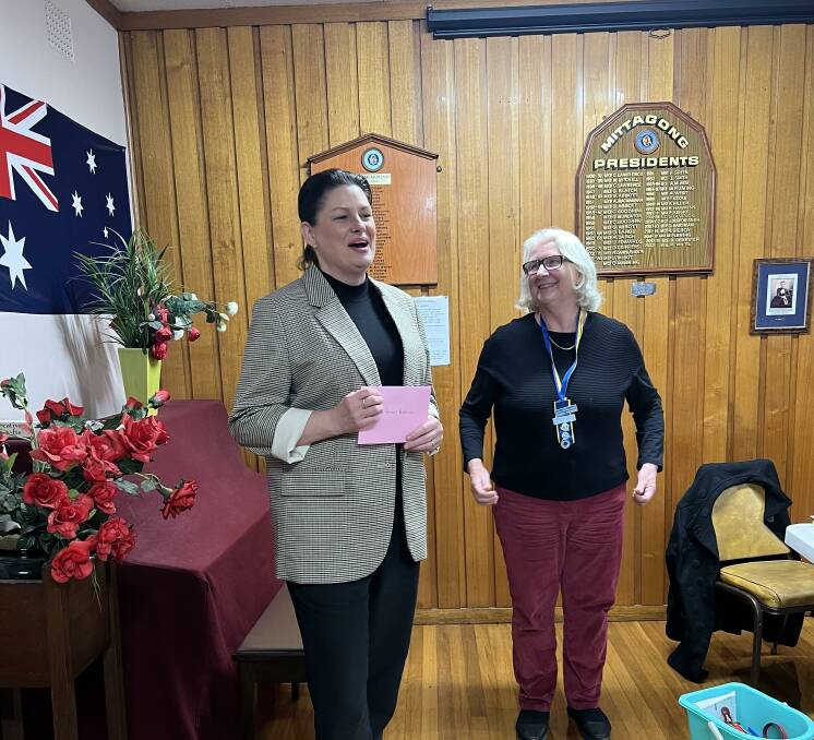 Rare Cancers Australia CEO Christine Cockburn received a cheque from Southern Highlands Evening CWA Jenny Woodwell for funds raised from the branch's fashion parade. Picture supplied
