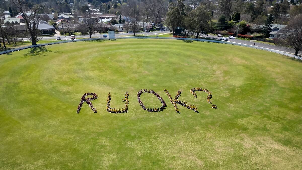 Students grathered at Bradman Oval in the lead-up to R U OK? Day to do different activities, and spell it out, which was captured by a drone. Picture by AJ Moran