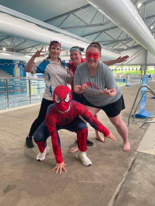 Moss Vale Aquatic Centre swim instructors Maddie Staples, Claire Wormleaton, Kirrilee Bracht and swim school manager and assisting facility manager Rhianna Clamp channeled superheroes for the heroic-themed Safety Week. Picture supplied. 