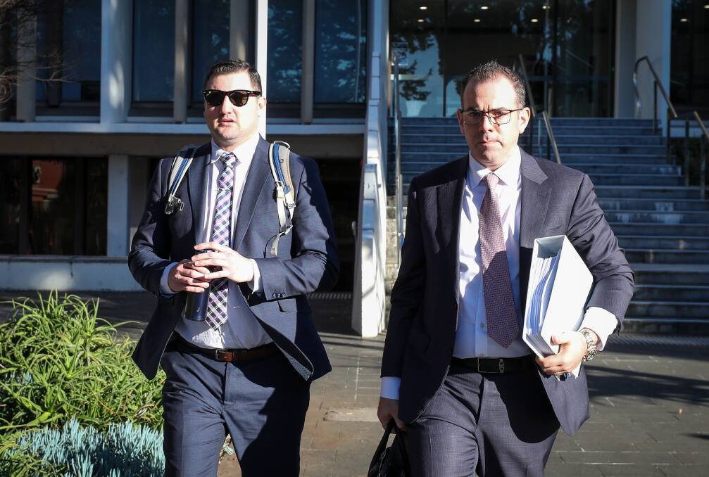 Keith Eshman (left) leaving Wollongong courthouse with his lawyer Robert Candelori (right) on June 27. Picture by ACM
