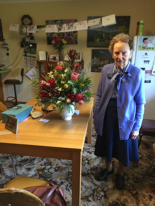 Bess Ackrigg shows off the many cards and flowers she recieved for her 100 year birthday. Picture supplied.