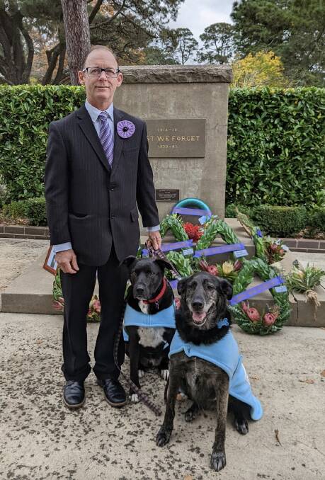 Army Veteran and Friends of Wingecarribee Animal Shelter member and volunteer Shane Tobler with his rescue dogs Freud and Archimedes. Photo supplied.