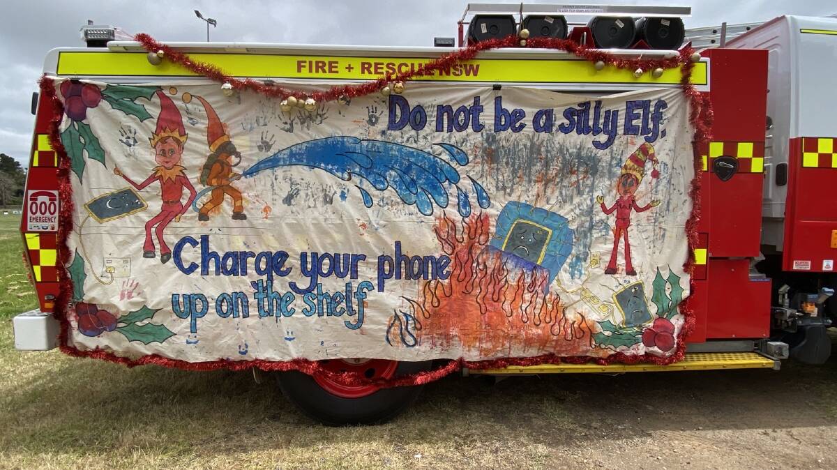 Moss Vale FRNSW were crowned winners with it's fire safety message. The banner was painted by students at Moss Vale Public School. Picture supplied. 