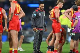 Gold Coast could be without injured co-captain Touk Miller (centre) for up to six games. (James Ross/AAP PHOTOS)