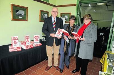 Hugh MacKay with his book What Makes Us Tick with the Wollondilly cultural officer Rhondda Van Zella and CWA publicity officer Claire Cooper.