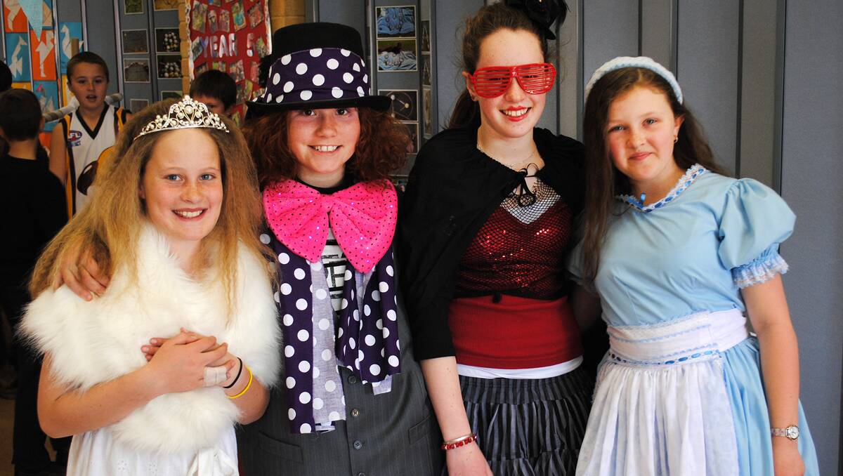 Year 5 students Lucia Pinn, Annalise Turner, Ellie Herring and Hannah Smallwood dressed as characters from Alice in Wonderland for the St Thomas Aquinas Catholic School book parade.  